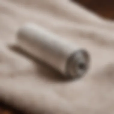 Close-up of a lint roller on a pet hair-covered fabric