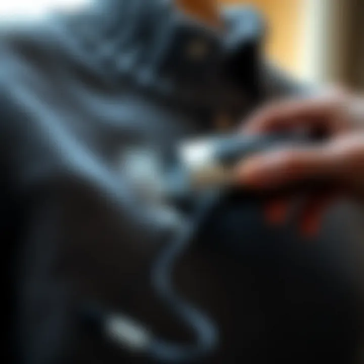 Electric sweater shaver removing lint from fabric