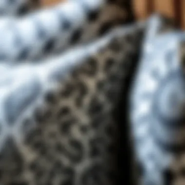 A close-up of intricate patterns on luxurious black and white cushion covers showcasing textile diversity.