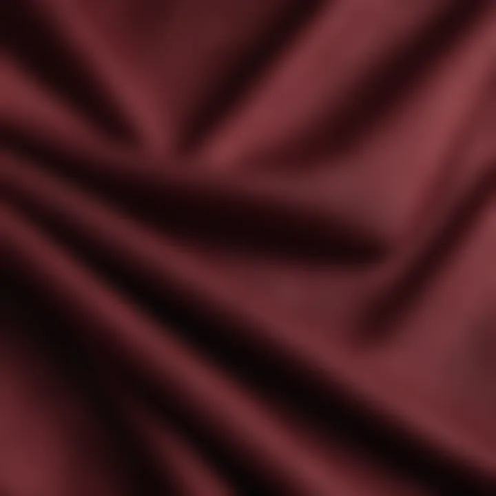 Close-up of burgundy linen fabric showcasing its texture and quality