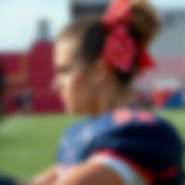 An athlete wearing a stylish football hair bow during a game.