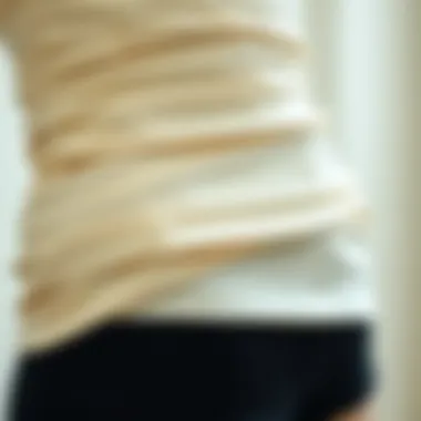 Close-up of fabric detailing on strapless bodysuit shorts