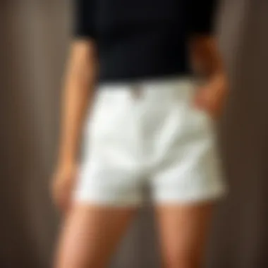 A stylish pair of high-waisted postpartum shorts on a neutral background