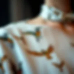 A close-up of a bird print blouse showcasing intricate details