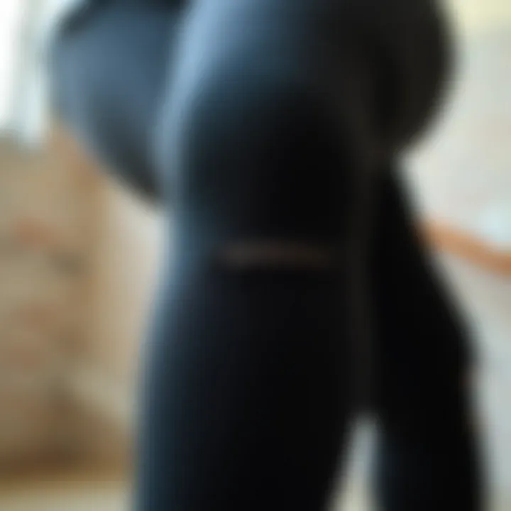 Close-up view of the fabric texture of plus size black distressed leggings